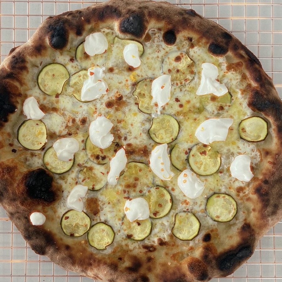 Charred white pizza with zucchini, fresh mozzarella and whipped lemon ricotta